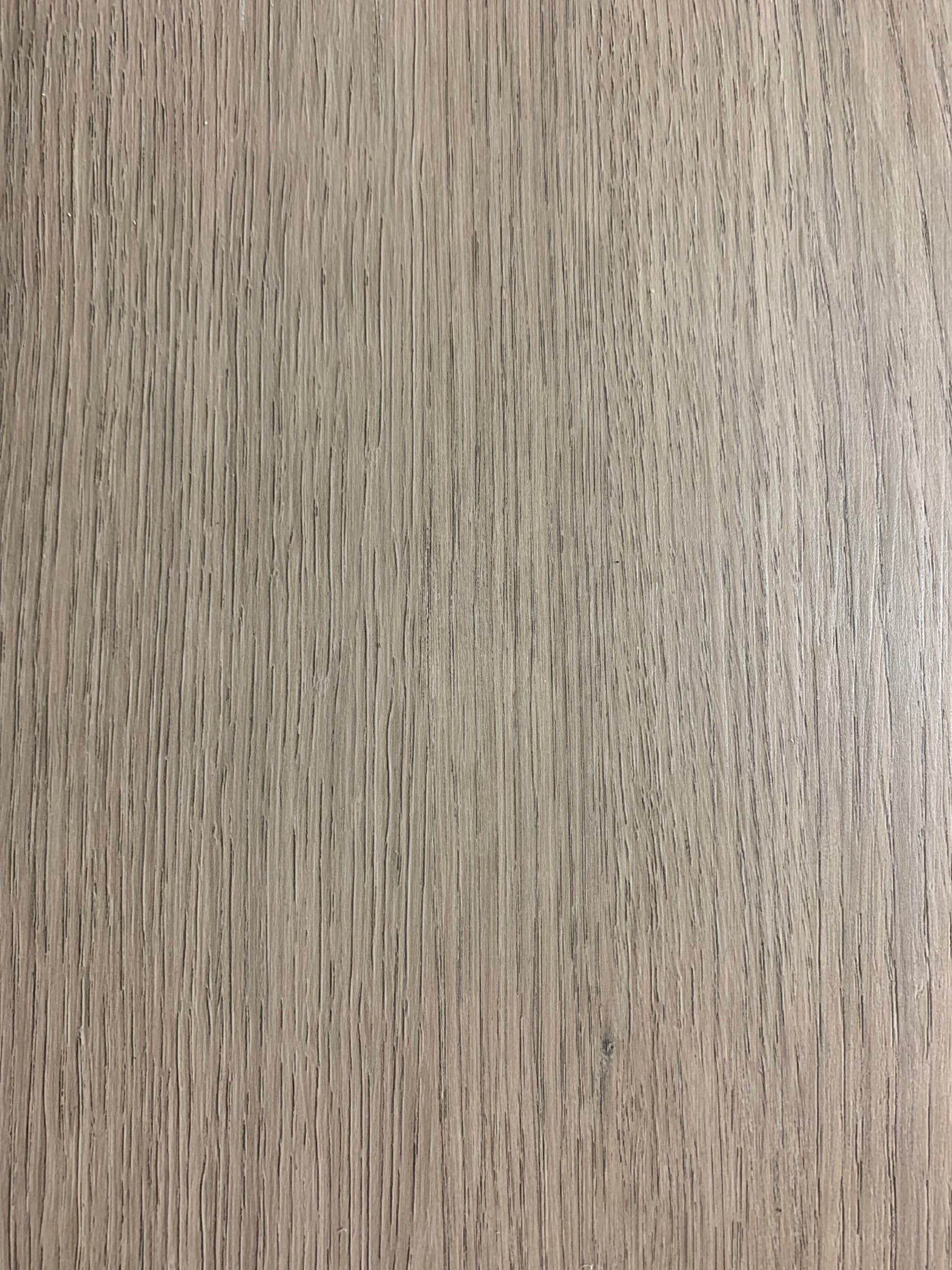 Close view of warm oak plank surface showing the wear layer finish
